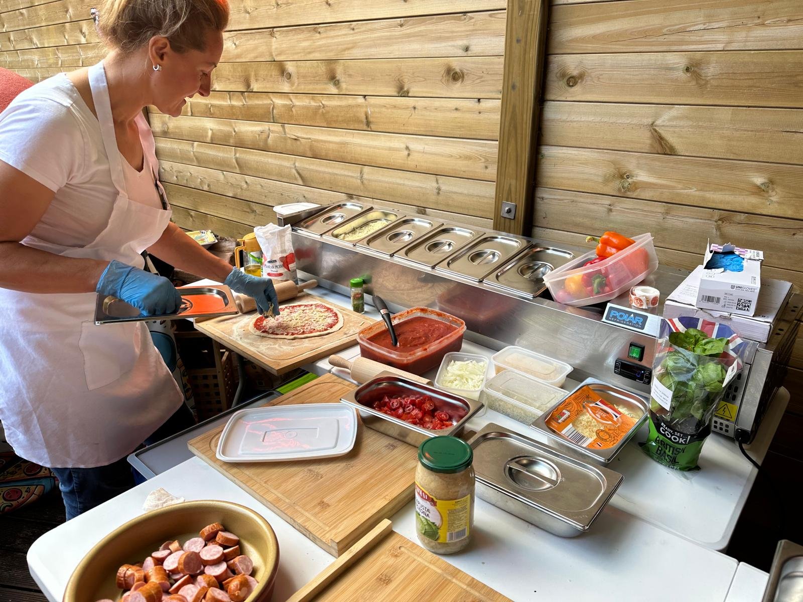 Yvona prepping toppings at the party