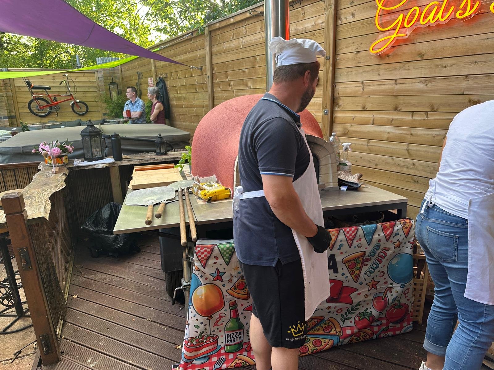 Peter at the wood-fired oven during a 60th birthday